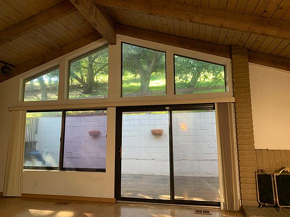 View from living room-dining room to back deck and foothills