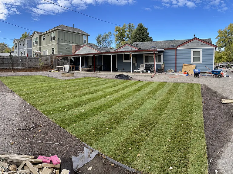 Large back yard, fire pit, and covered back patio area