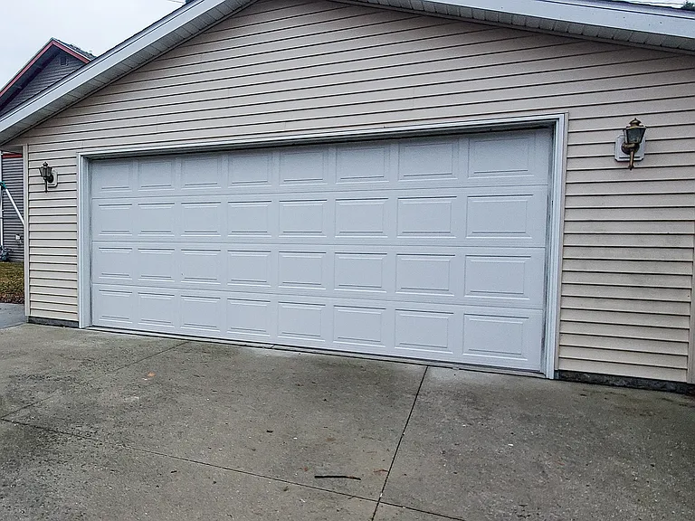 2 car detached garage with large driveway as well as street parking
