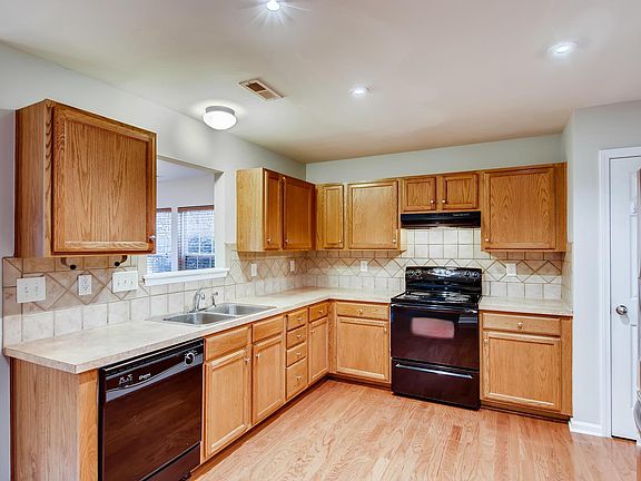 Kitchen with pass thru to sunroom/den.