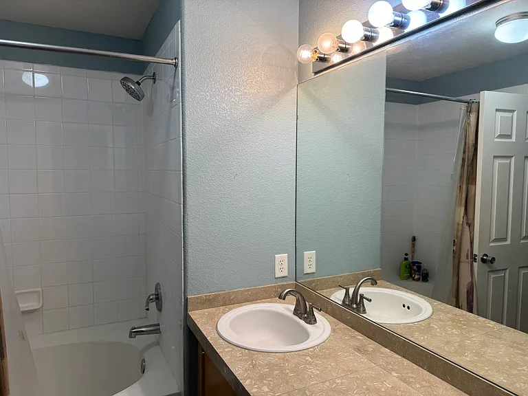 Fossilized limestone countertops and slate floors in the master bath