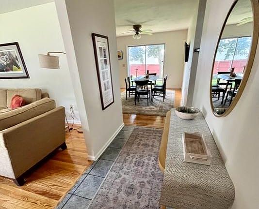 front entrance hall, LR on left, view of dining area and sliding glass door to yard