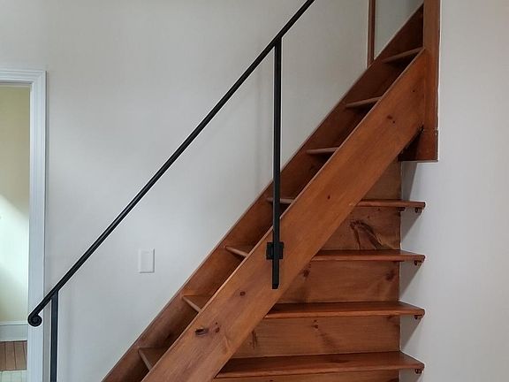 Book case and stairs to loft from living area