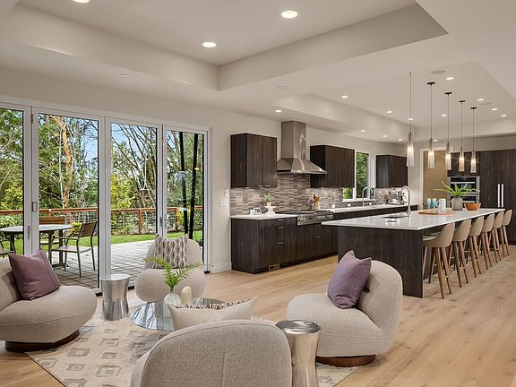 Hearth room (or informal dining area) flows into entertaining kitchen + opens via LaCantina folding doors to the covered patio area