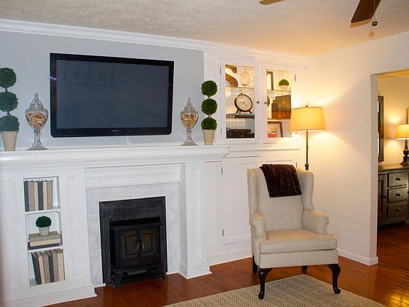 TV room with built-in cabinetry.