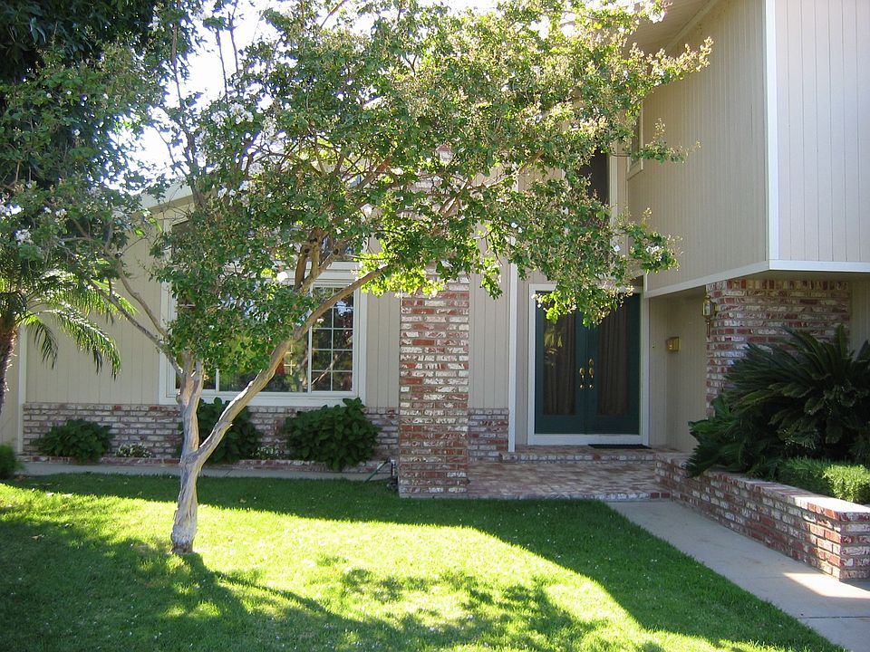 Lush manicured landscaping resembles a park.