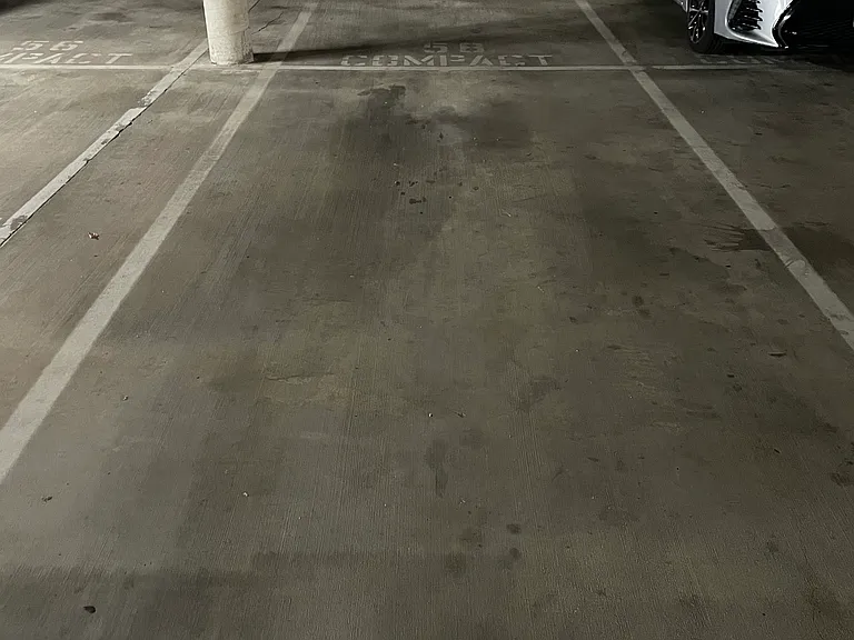 Tandem parking spots in gated garage.