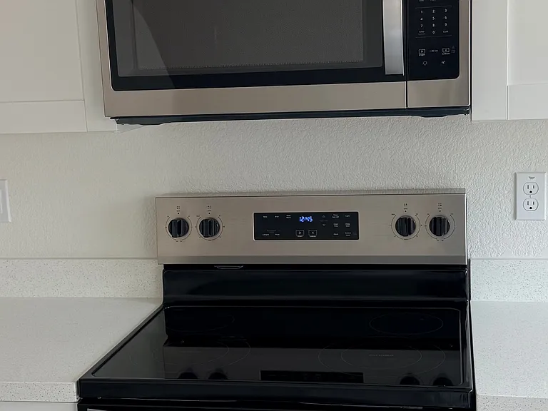 Whirlpool stainless steel microwave and 100% electric range
