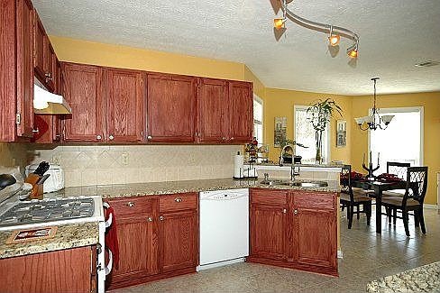 Kitchen with New Granite Counter Tops and Cabinets
