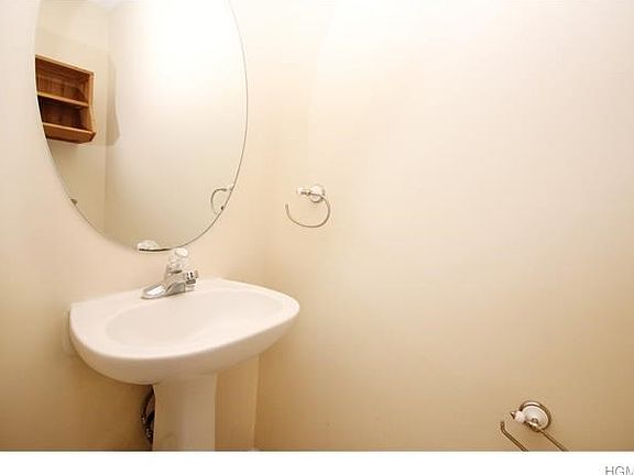 Downstairs half bath with pedestal sink
