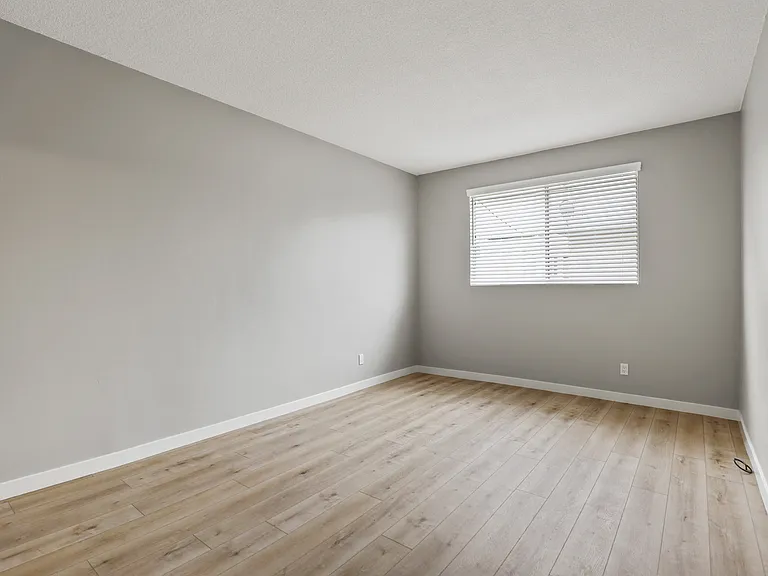 Large-Size Bedroom with Vinyl Flooring and Windows