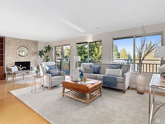 Spacious living room with fireplace and deck access.  