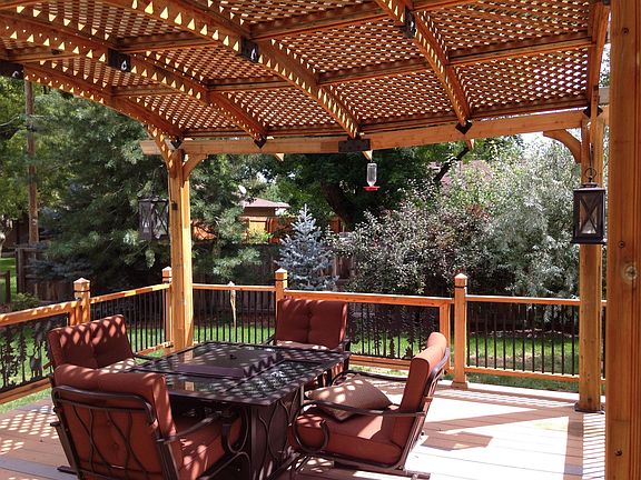 Partially shaded deck in backyard off of kitchen door