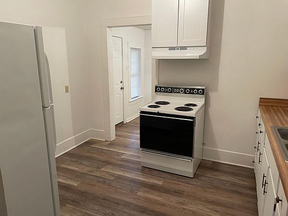 Kitchen from dining looking towards laundry.