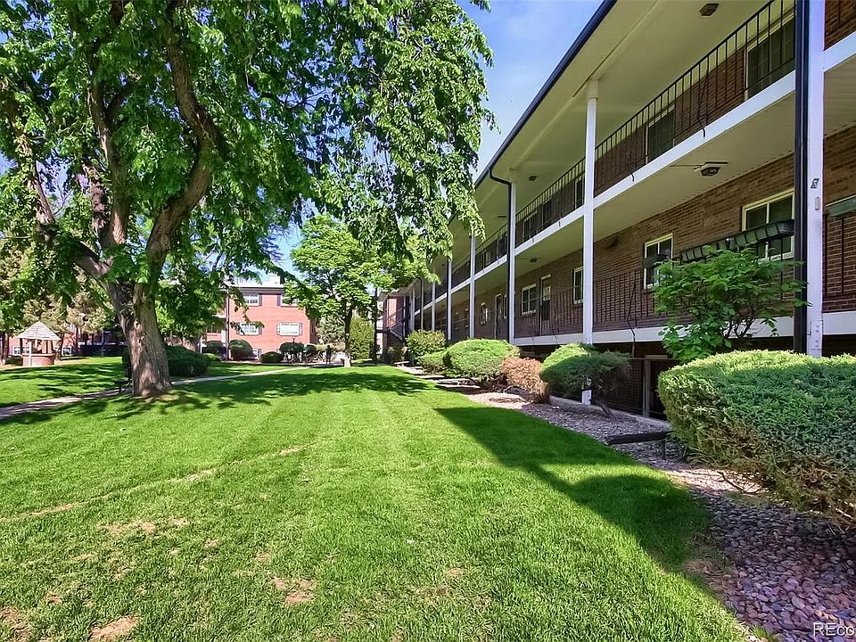 Shared community courtyard with trash cans and doggie bag available