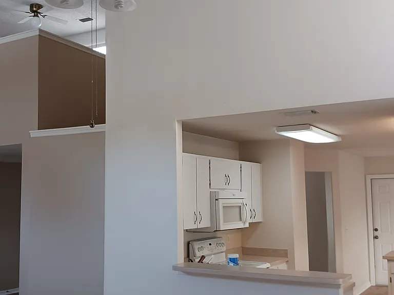 Kitchen and Upstairs Bonus Room from Grate Room