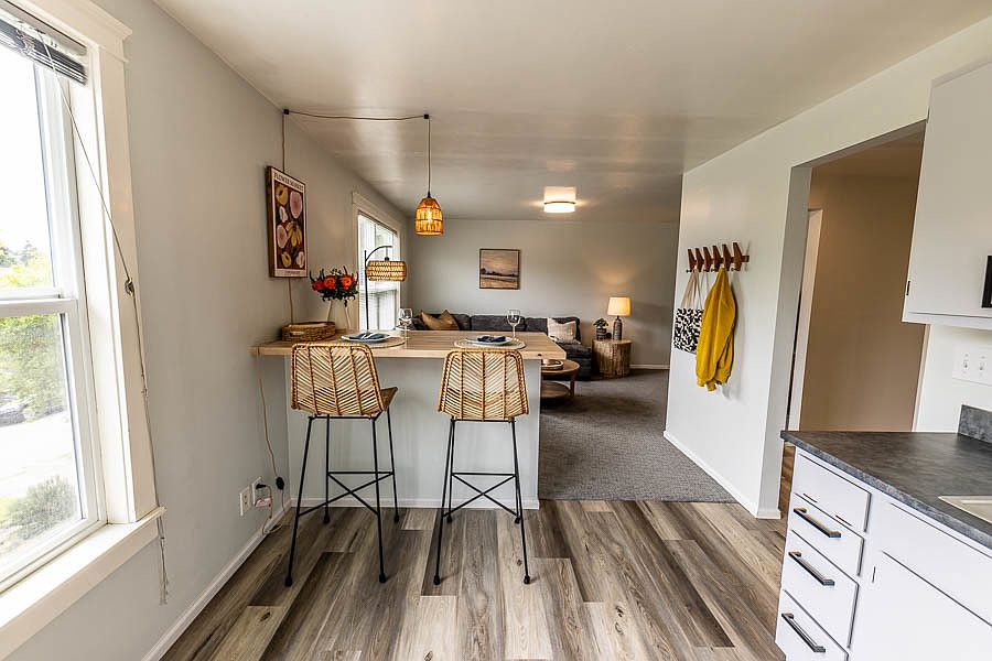View from kitchen into the living room. Built in bar for dining or to be used as a work station
