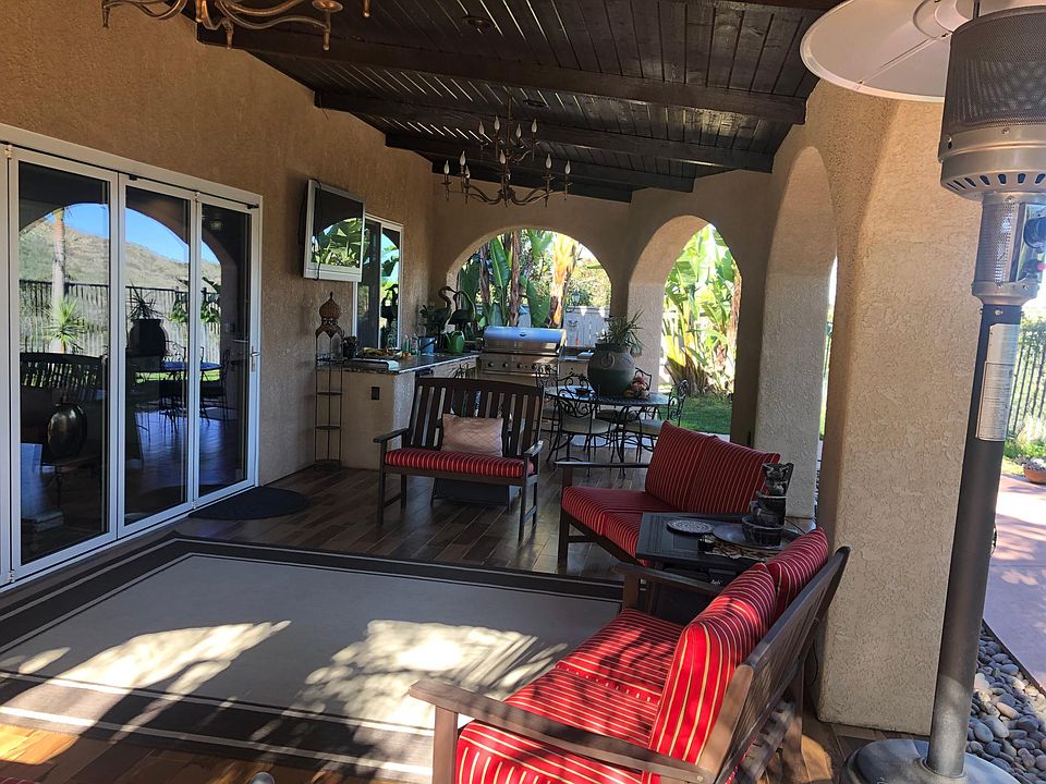 Additional Patio feature with folding Nanawall door. With an outdoor kitchen and Barbeque grill.