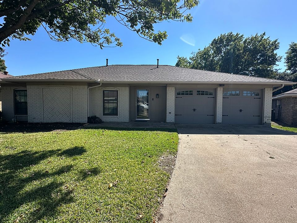 Nestled in a quiet cul-de-sac and under a mature shade tree.