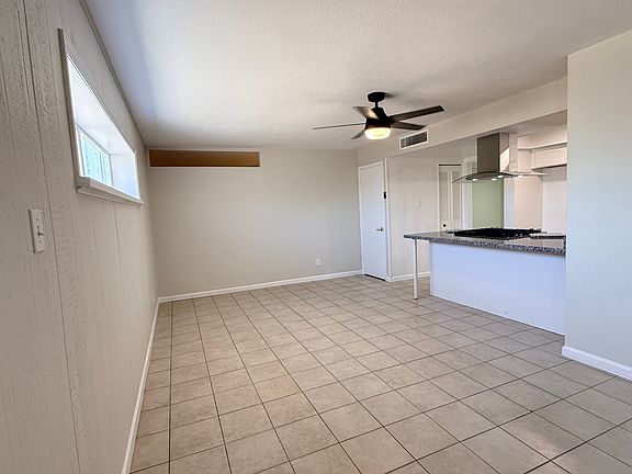 Spacious Dining area with bar seating. Two kitchen pantries