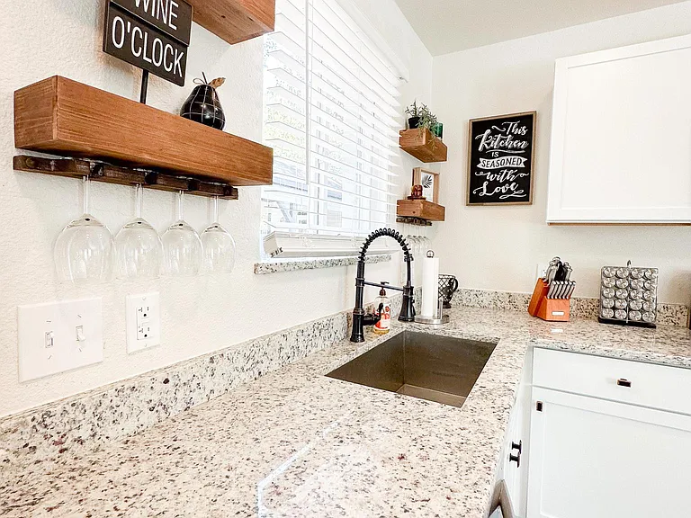Large Sink, Condiments and Granite Countertops