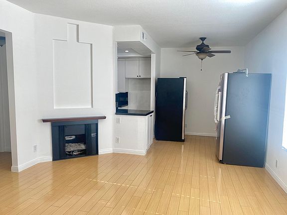 photo shows old & new fridge sitting in dining room. New fridge has since been installed and hooked up to waterline and old fridge has been removed.