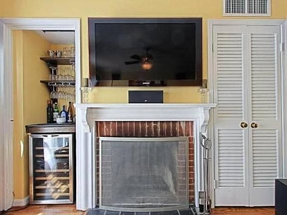 Pre-mounted 55 inch TV and wine refrigerator included in ren