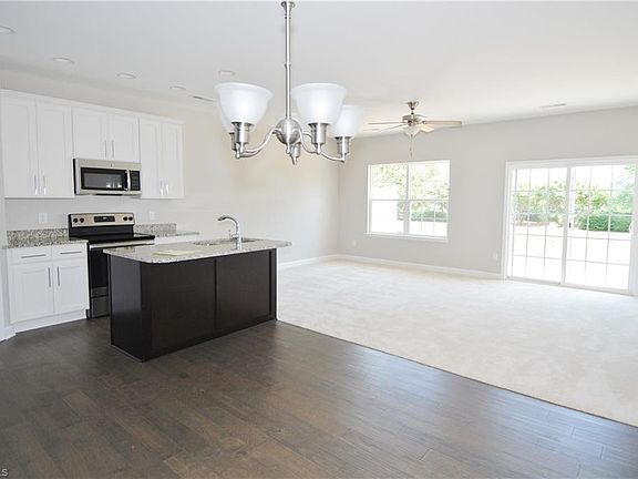 Natural light floods the open-concept living spaces. Ideal for family time or entertaining.
