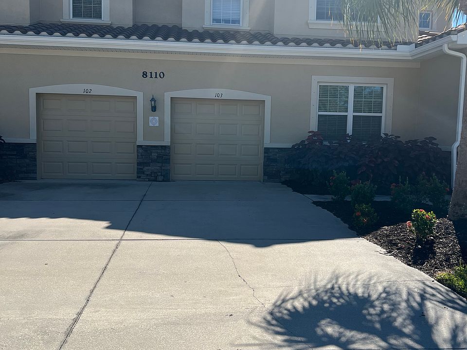 drive way and attached garage First floor unit. The garage is the one on the left.