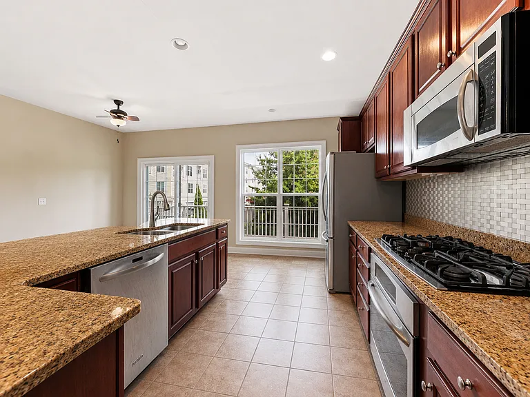 2nd Level - Spacious Kitchen with Access to Rear Deck
