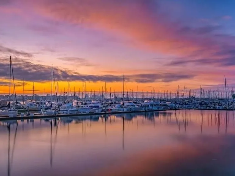 The picture of a sunset captured from the boardwalk on the side of the condo