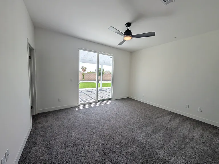 Primary bedroom with direct access to huge covered patio