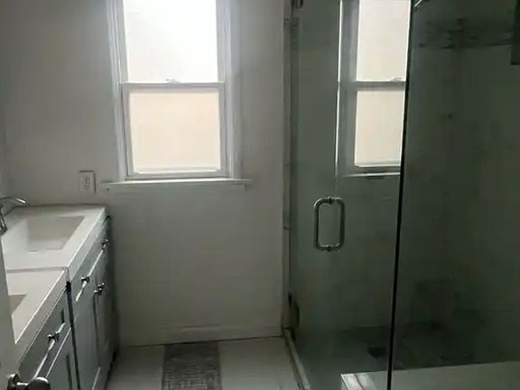 1st bathroom, with double sink.