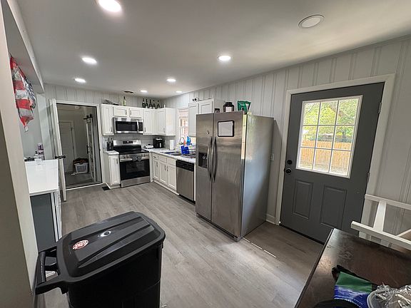 Door to backyard and sideview of kitchen (far door opens into the mudroom)