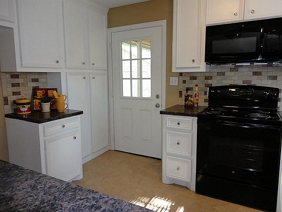 The well designed kitchen also has a Texas sized pantry and Coffee Bar.!