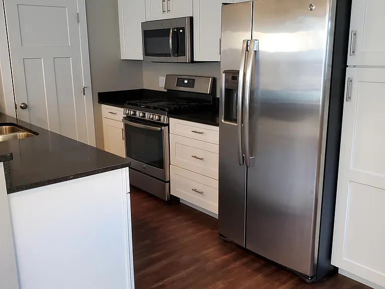 Kitchen profile, plenty of storage and cupboard space as well as pantry storage. New Stainless appliances. Gas stove with a griddle, DW & Disposal.