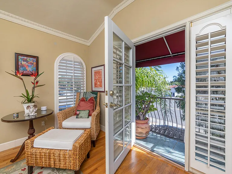 Primary Bedroom sitting area with French doors leading to balcony