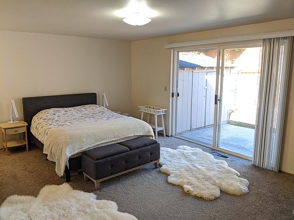 Master bedroom with access to backyard and patio.