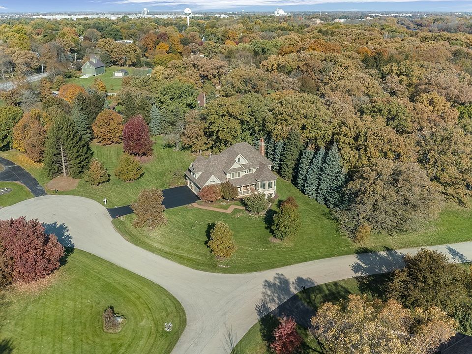 This fabulous custom home is located on a 1+ acre cul-de-sal lot is beautifully landscaped and borde