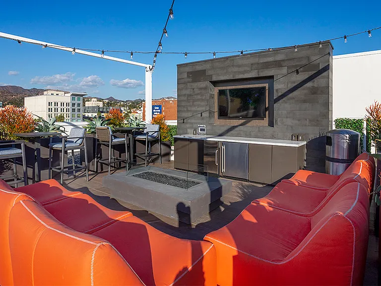Rooftop lounge with HDTV, firepit, and stunning views