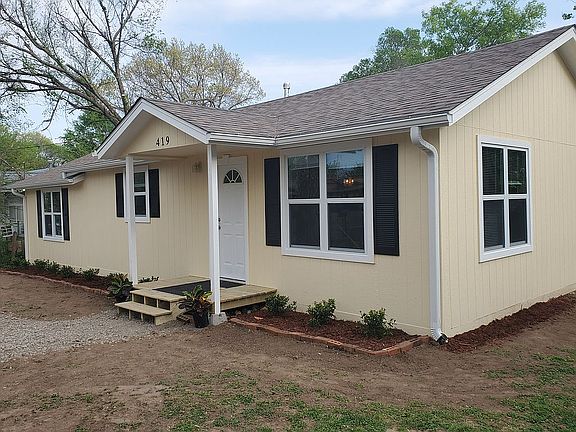Shrubs & circle driveway add