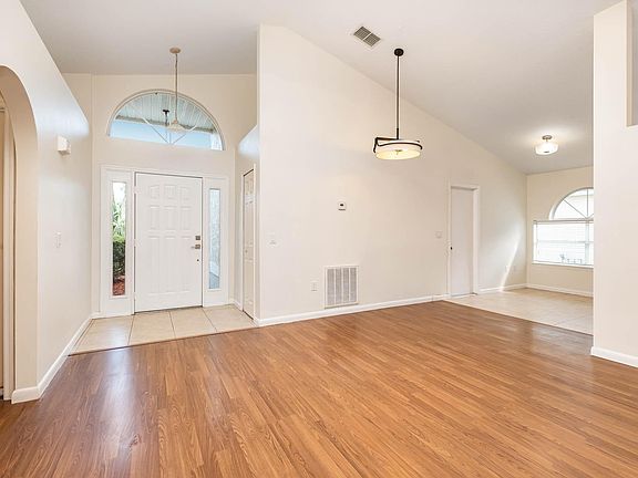 Entry way with hall closet, leads into living and dining spaces.