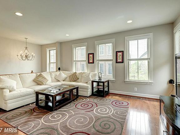 Sunny Living Room at the Top of Stairs