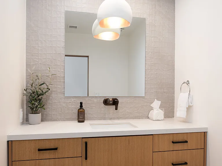Powder bathroom with smart toilet located on the 1st floor.