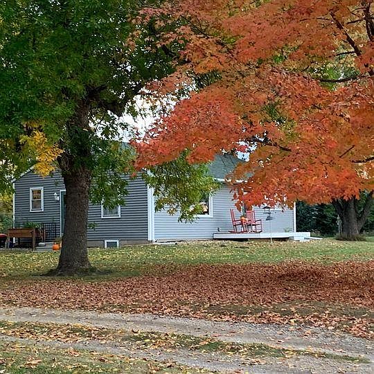 Lovely country home on about 1 acre of land with large private yard and mature trees.
