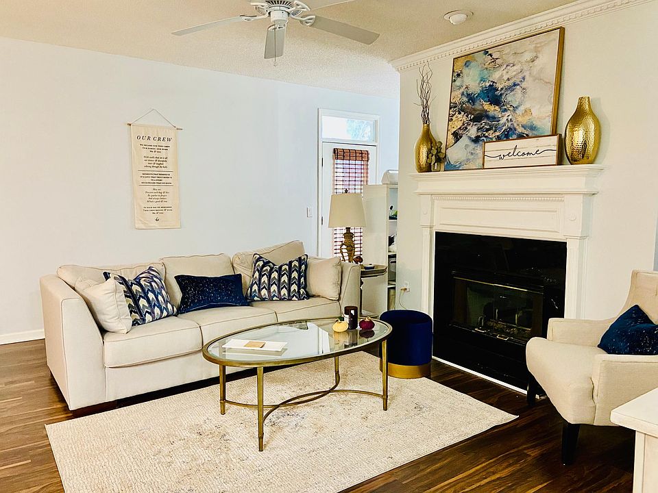 Main living area - fireplace is now retiled with a lighter coloring. (Unit is offered unfurnished).