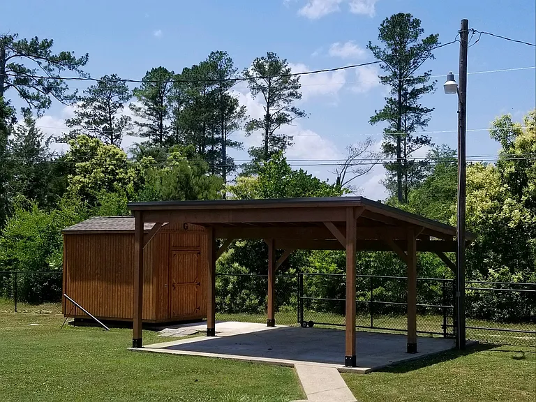 storage building and 2nd carport that can be used for a vehicle or for entertainin, rolling gate is accessed by way of common alleyway
