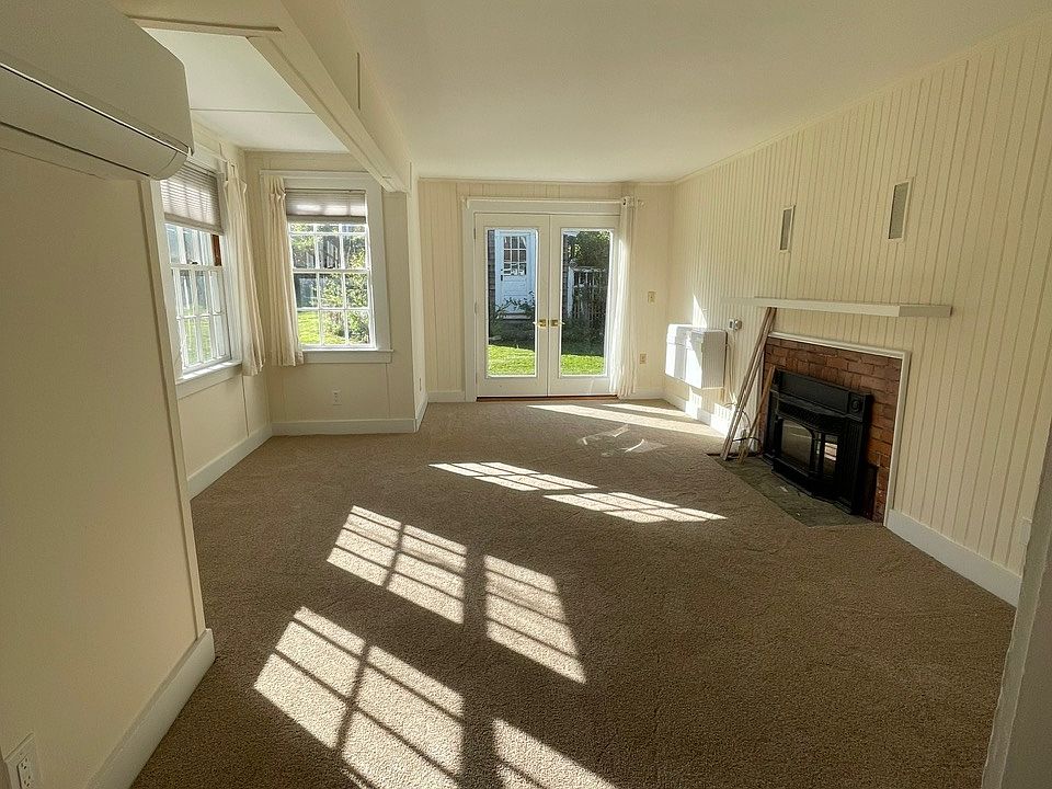 Sunlight streams into the living room where the windows face south.