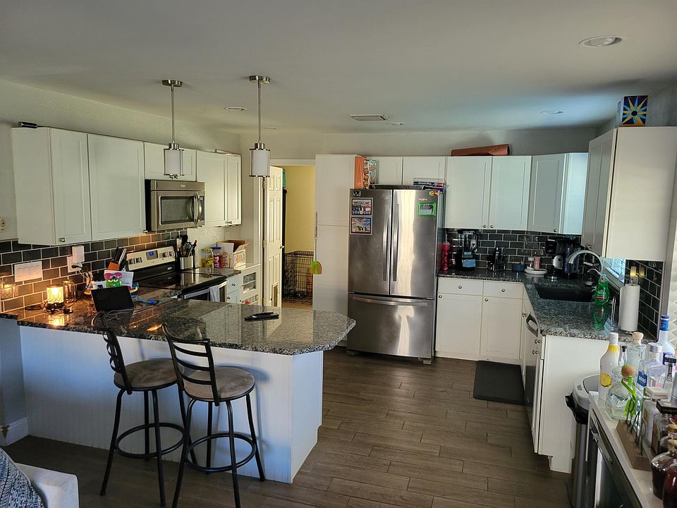 Kitchen Area, Through the open door leads to storage room and laundry room