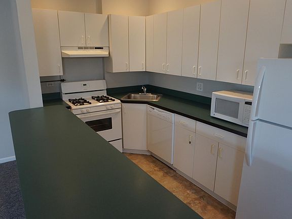 Large kitchen with tons of cabinets. Microwave is actually built in now above the range.
